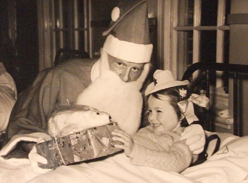 Christmas 1955 – Santa (Dr Sawyer) with patient